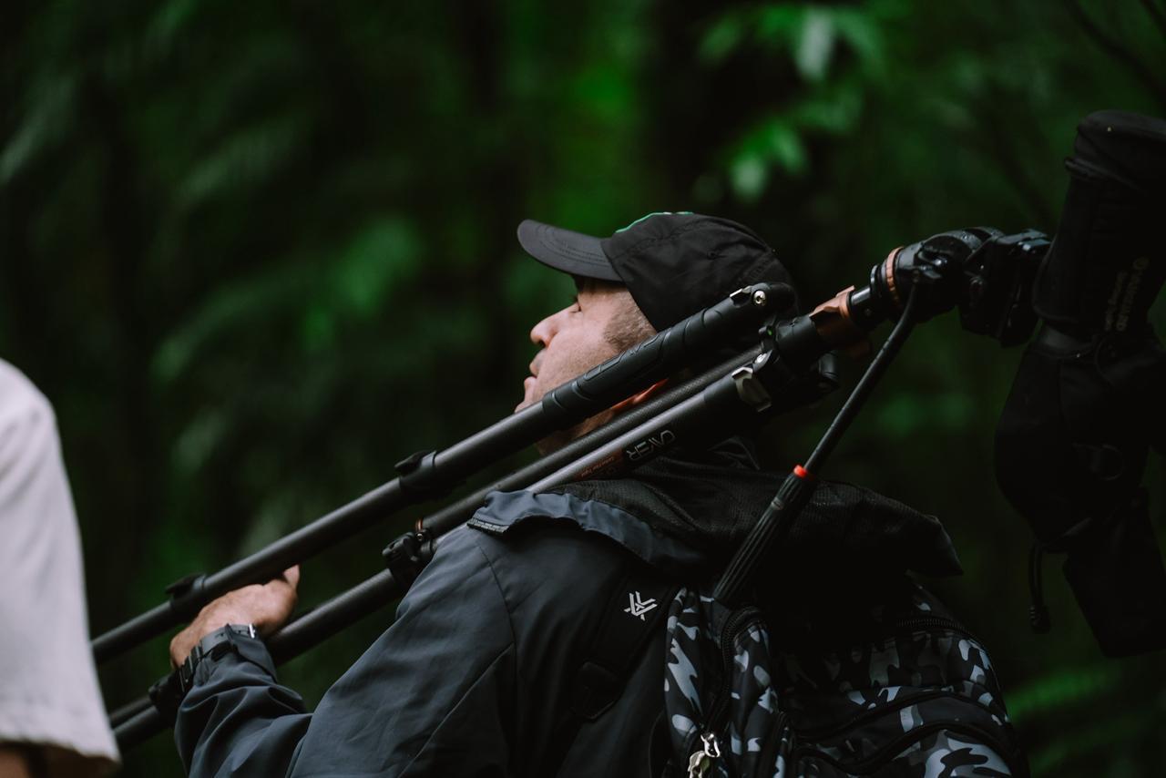 Juan Carlos scanning the forest canopy for birds in Monteverde, Costa Rica