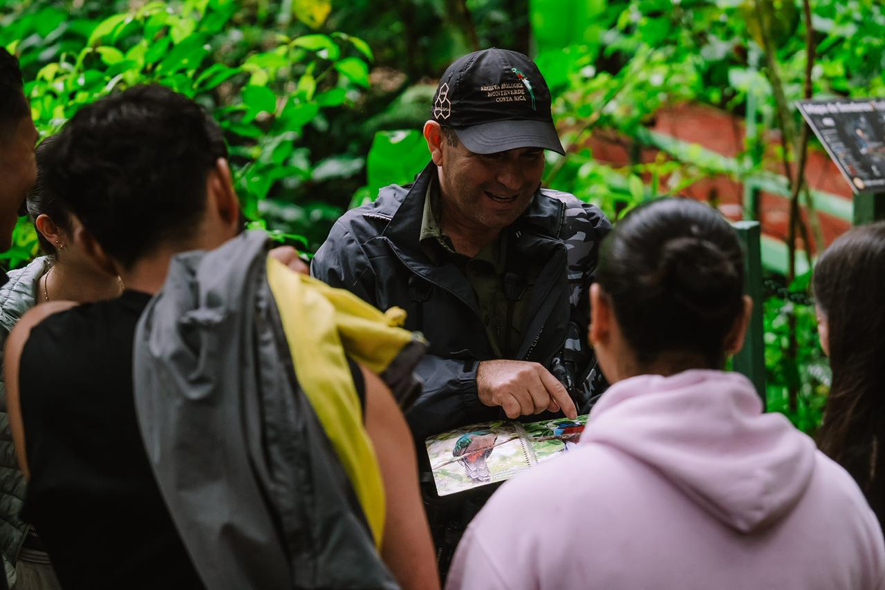 Juan Carlos explaining cloud forest wildlife to visitors in Monteverde